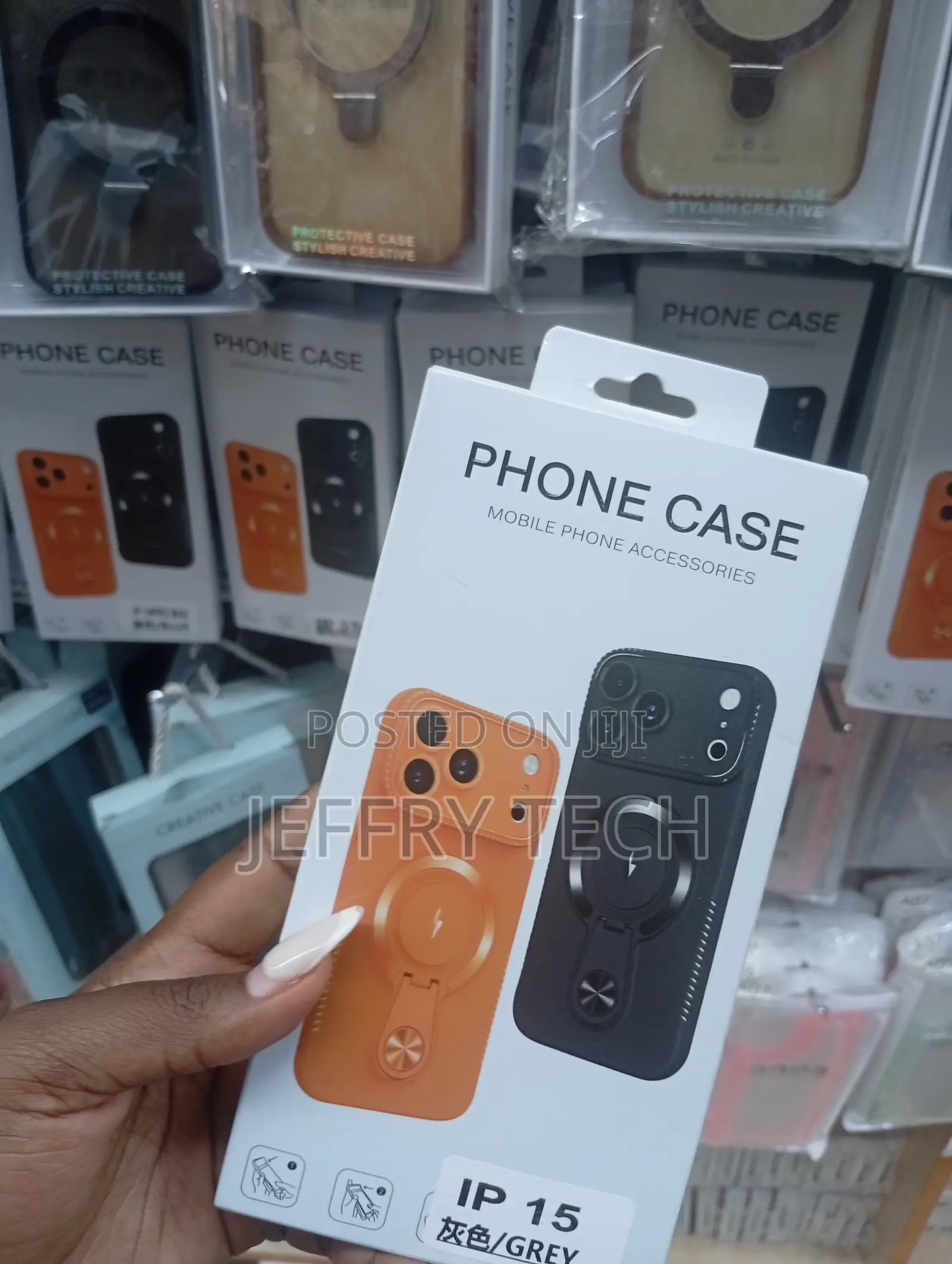 Magnetic Charging Phone Covers for the iPhone 15 in Grey and Orange.