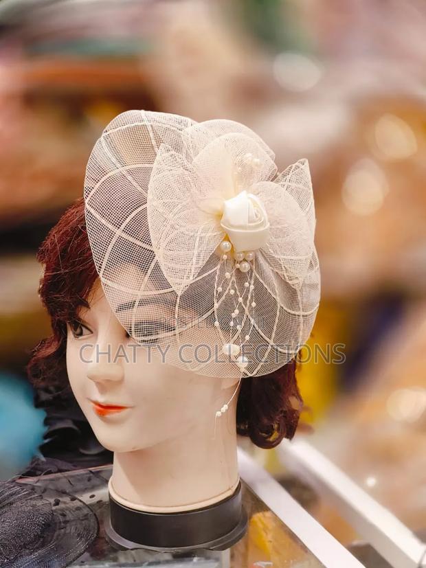 Cream Stylish and Cutesy Ladies Head Fascinators With Net and Bead