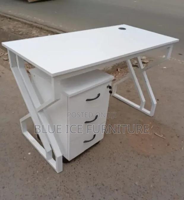 Office With Metallic Desk With White Lockable Drawers