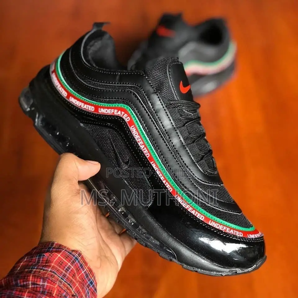 Undefeated X Nike Air Max 95 Sp Sneakers in a Black, Green, and Red