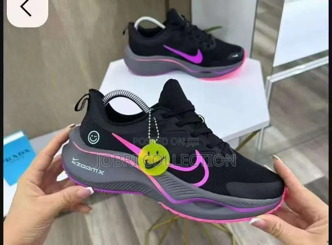 Ladies Black and Pink Nike Zoom X Sneakers