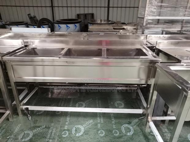 Commercial Stainless Steel Triple Sinks.
