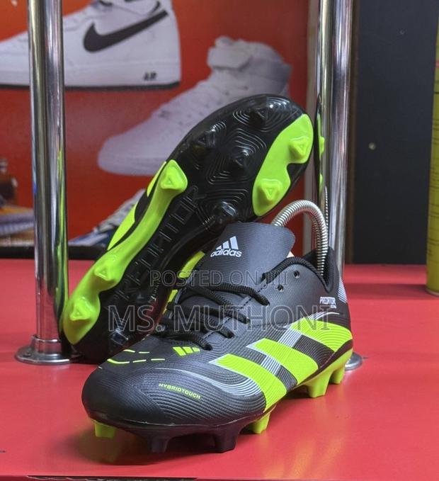 Kids Black and Neon Green Adidas Predator Soccer Cleats. (Size 30-40)