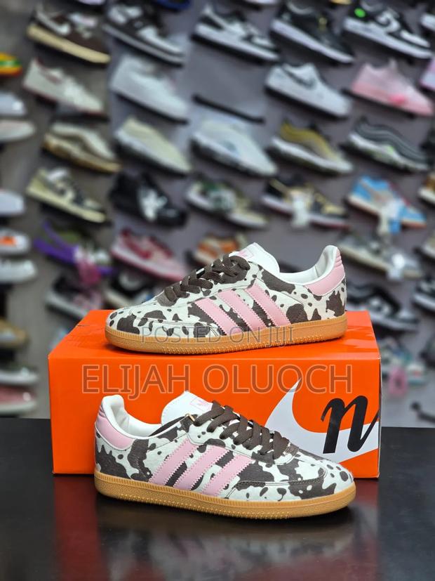 Adidas Samba Og Cow Print Sneakers in Dark Brown, White, and Pink.