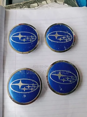 Blue Subaru Wheel Center Caps Featuring Classic Six Star Emblem