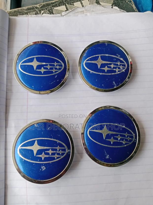 Blue Subaru Wheel Center Caps Featuring Classic Six Star Emblem