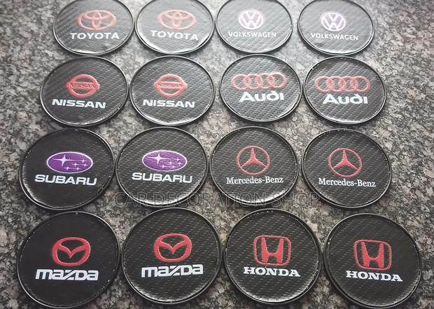 2pc Decorative Carbon Fiber Style Inserts Branded Car Logo Coasters - main view