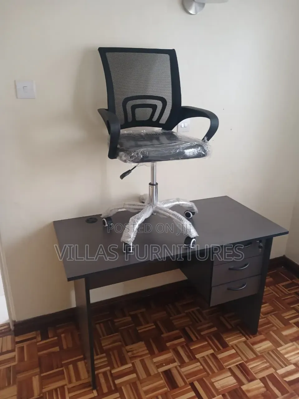 A Modern Wooden Desk With Mesh Office Chair