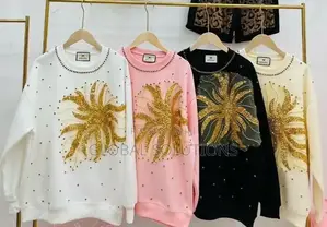 Sweatshirt With a Gold Sequin Starburst Design on the Front