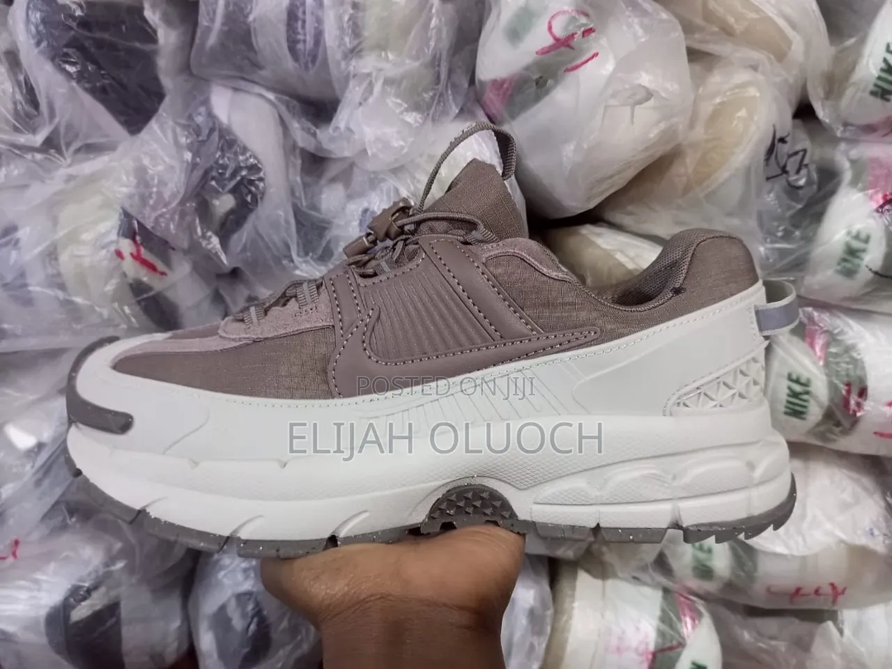 Lightvbone and Brown Nike Zoom Vomero Roam Sneakers