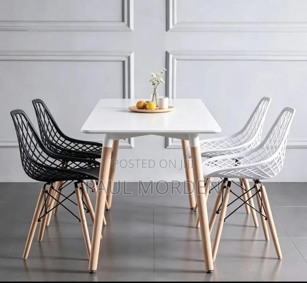 Rectangular White Table With 4 White Eames Chair in Stock