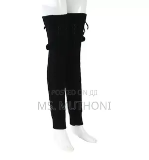 Cable-Knit Leg Warmers Featuring Decorative Pom-Poms and Ribbed Cuffs
