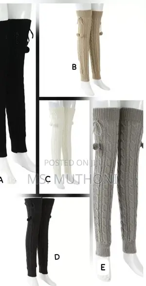 Cable-Knit Leg Warmers Featuring Decorative Pom-Poms and Ribbed Cuffs