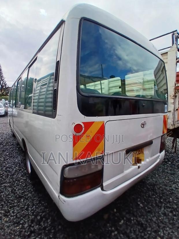 Toyota Coaster 2013 White - thumbnail 4