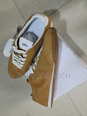 Alo Yoga Sunset Suede Sneakers in a Caramel Color.