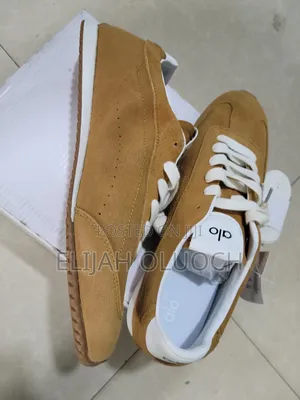 Alo Yoga Sunset Suede Sneakers in a Caramel Color.