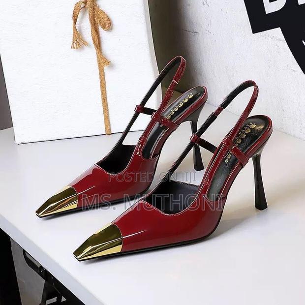Slingback Heels Featuring a Pointed Toe With a Gold Metal Cap Pumps