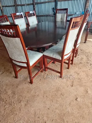 A Dinning Table With 8 Chairs