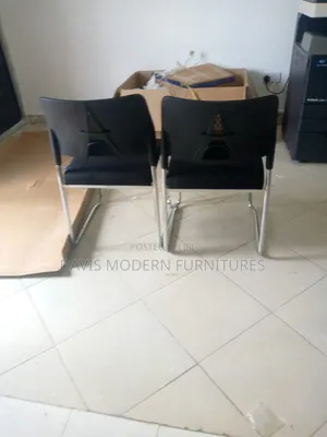 Pair of Black Cantilever Visitor Chairs With Mesh Backrests