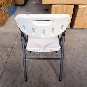 Office Chair : White Plastic Folding Chair With a Gray Metal Frame.