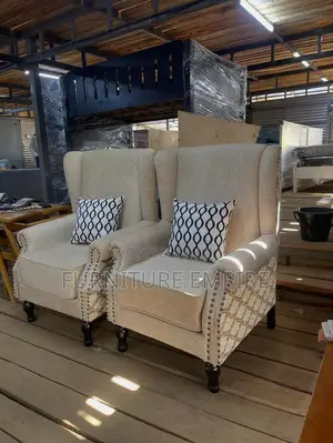 Elegant Beige Armchairs With Patterned Cushions