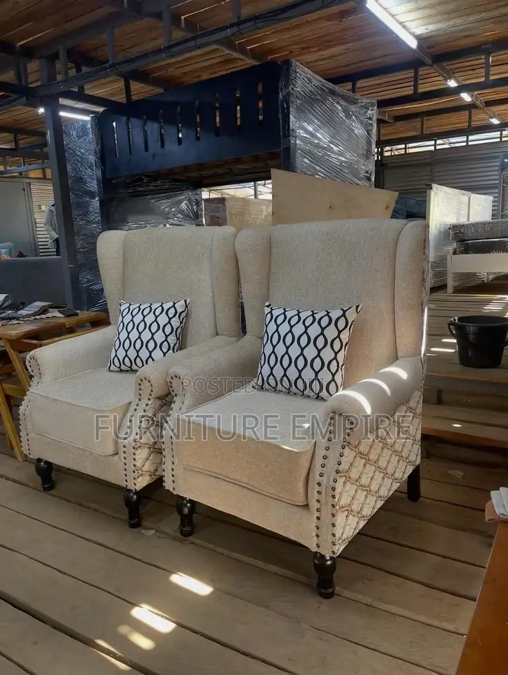 Elegant Beige Armchairs With Patterned Cushions