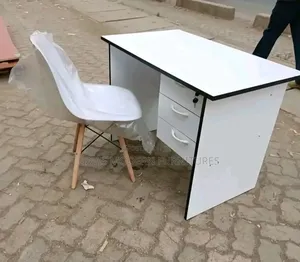 A Small White Office Desk With Chair Set