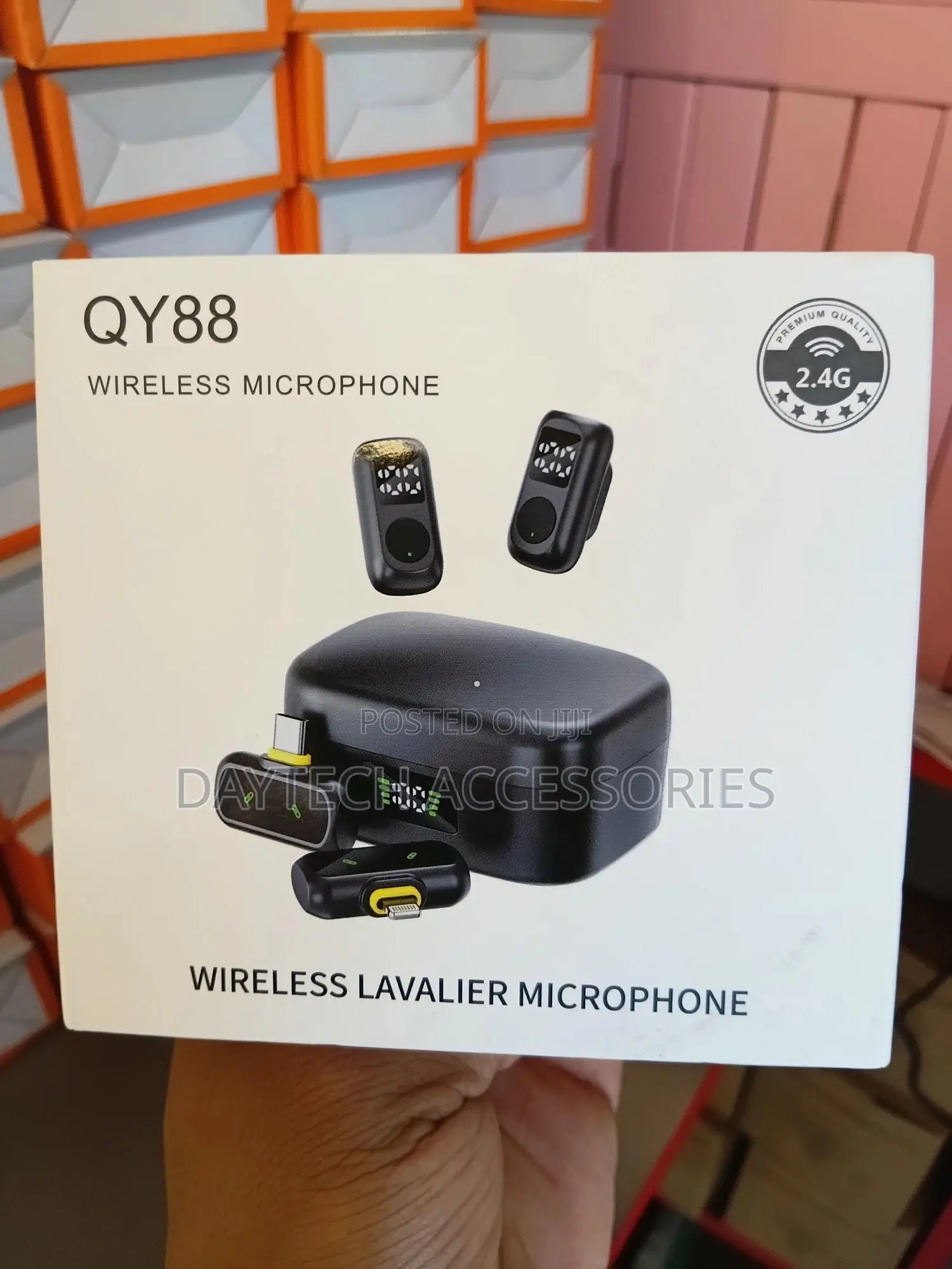 Qy88 Wireless Lavalier Microphone System With a Charging Case.