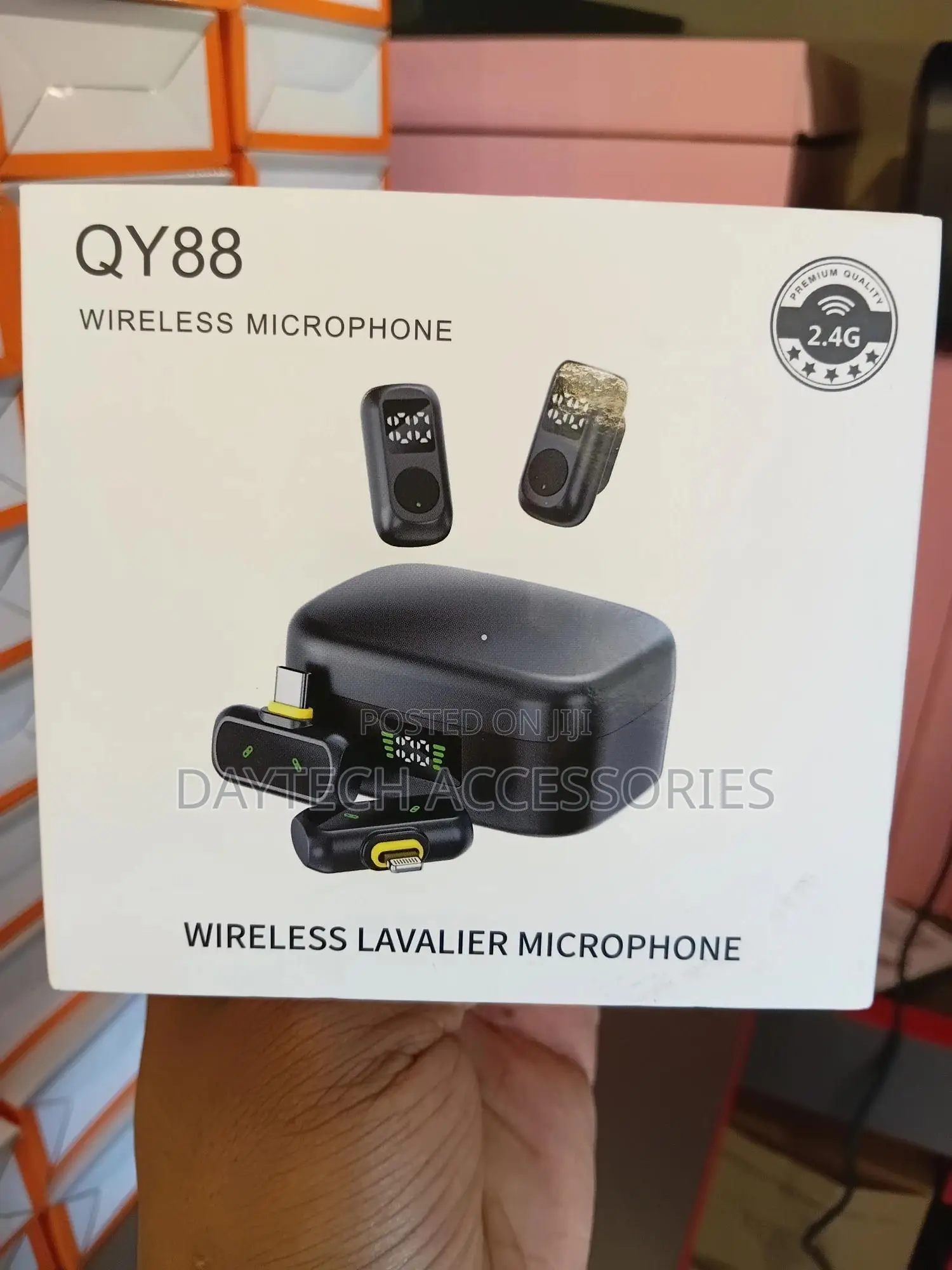 Qy88 Wireless Lavalier Microphone System With a Charging Case.