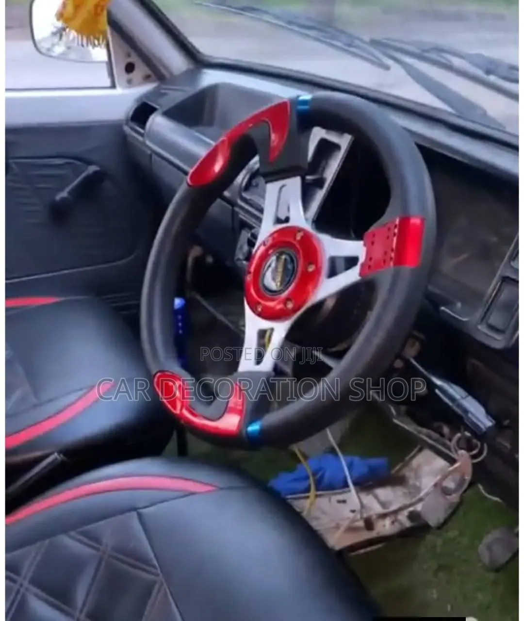 Car Fitted With Red Black Momo Steering Wheel With Sporty Style