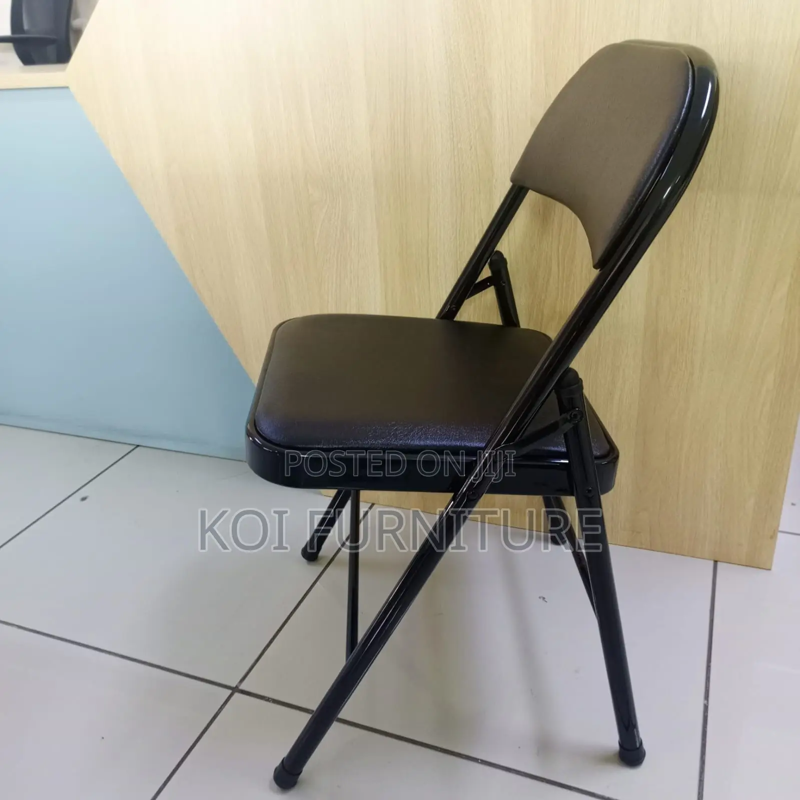 Office Chair : Padded Black Leather Foldable Chair With a Steel Frame