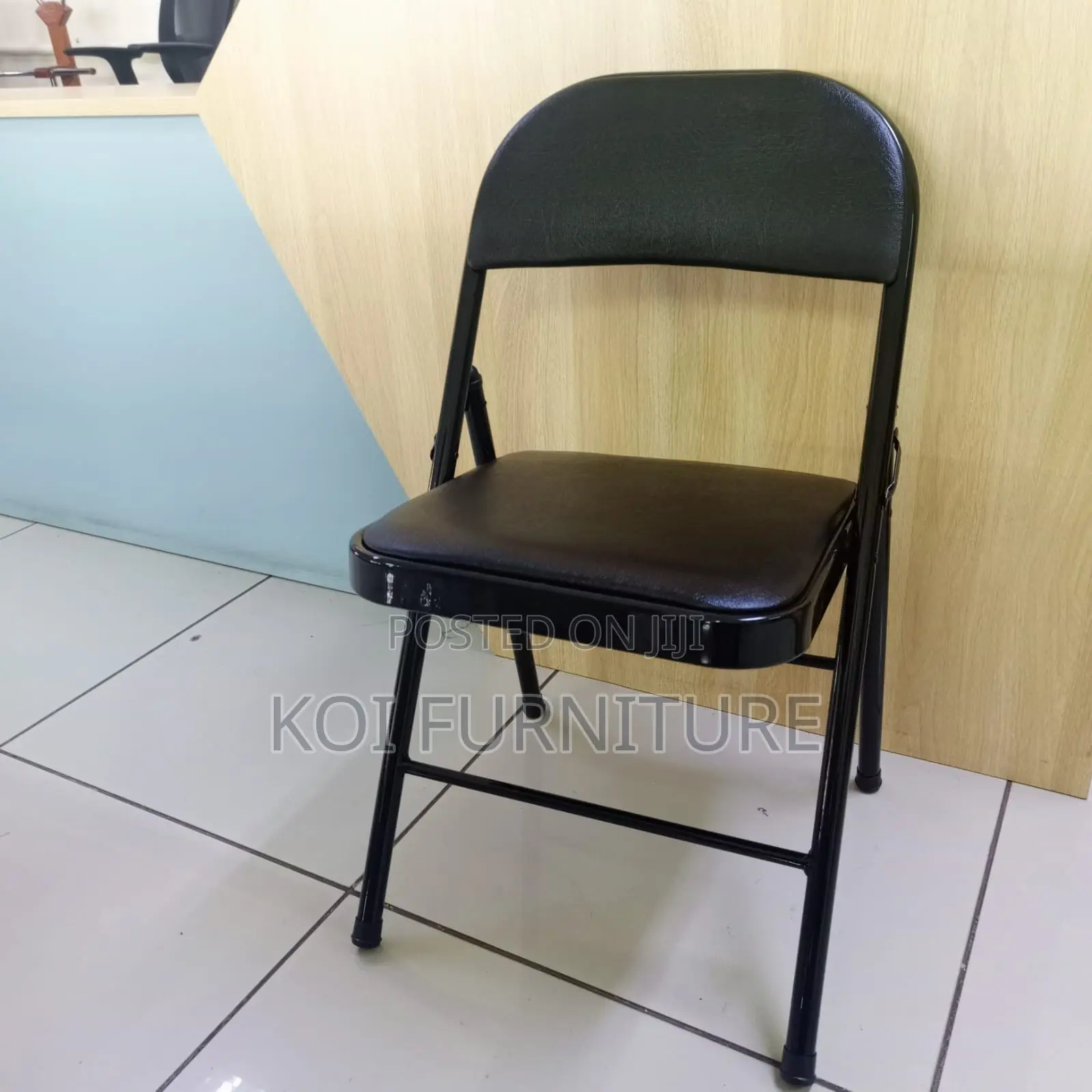 Office Chair : Padded Black Leather Foldable Chair With a Steel Frame
