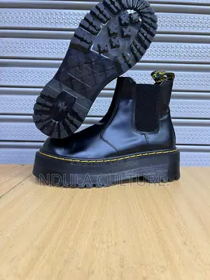 Dr Martens Boots and Gucci Sneakers