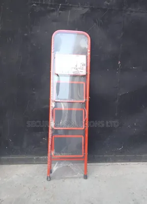 A 4-Step Foldable Steel Ladder With a Red Frame