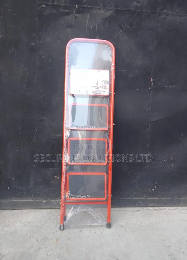 A 4-Step Foldable Steel Ladder With a Red Frame - thumbnail 2