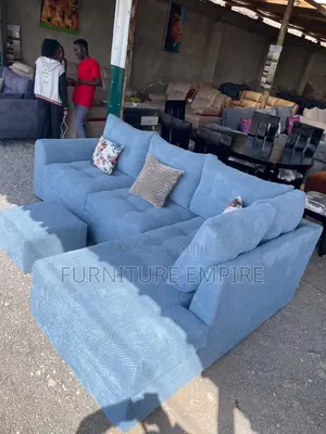 Spacious Blue Sectional Sofa With Decorative Cushions
