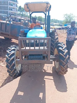 Tractor Tt 55 Four Wheel With Plough