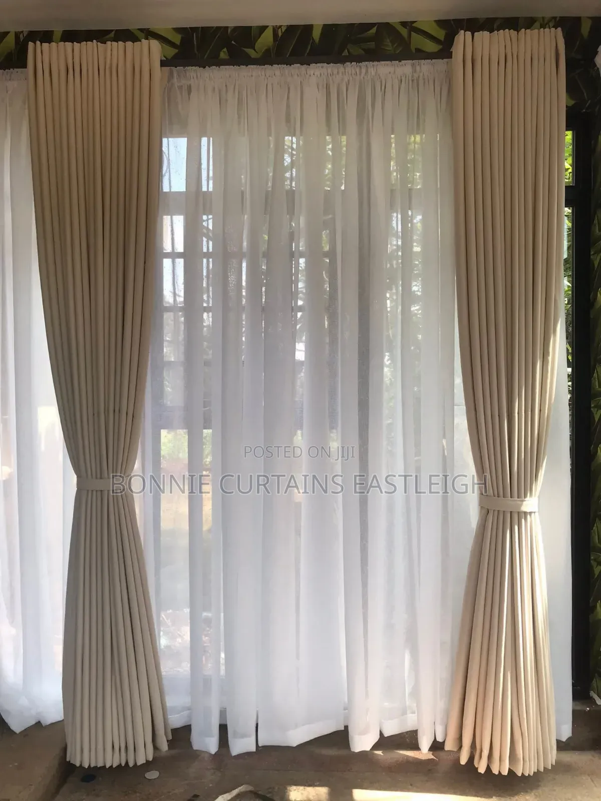Cream Curtains With Rings and White Sheers