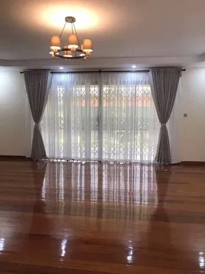 Cream Curtains With Rings and White Sheers