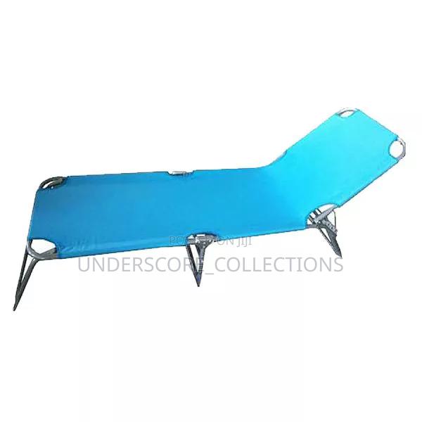 Foldable Lying Bed With a Vibrant Blue Fabric - main view