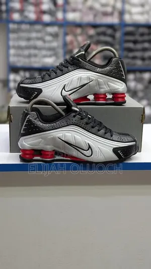 Nike Shox R4 Sneakers in a Black and Metallic Silver
