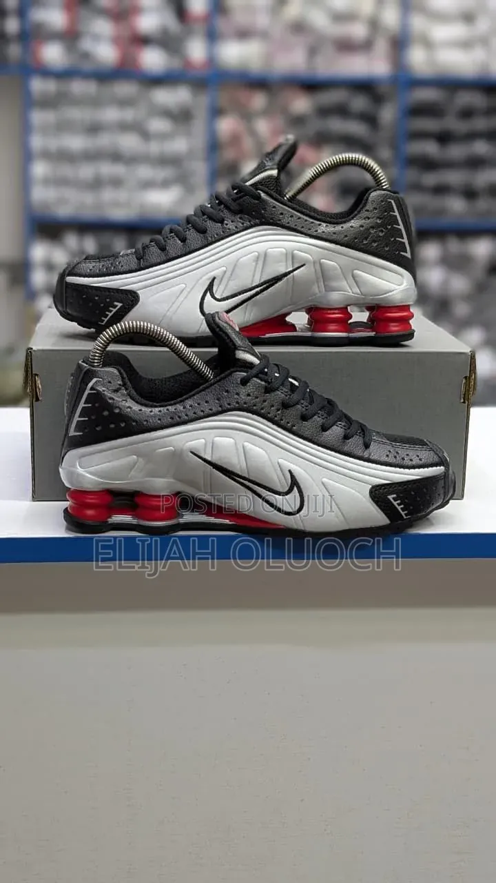 Nike Shox R4 Sneakers in a Black and Metallic Silver