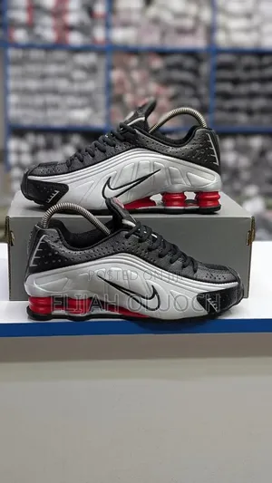 Nike Shox R4 Sneakers in a Black and Metallic Silver