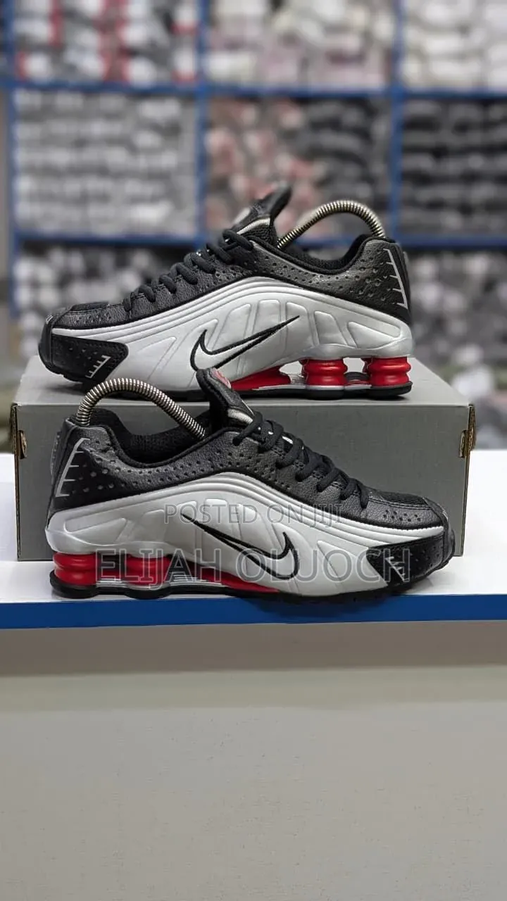 Nike Shox R4 Sneakers in a Black and Metallic Silver