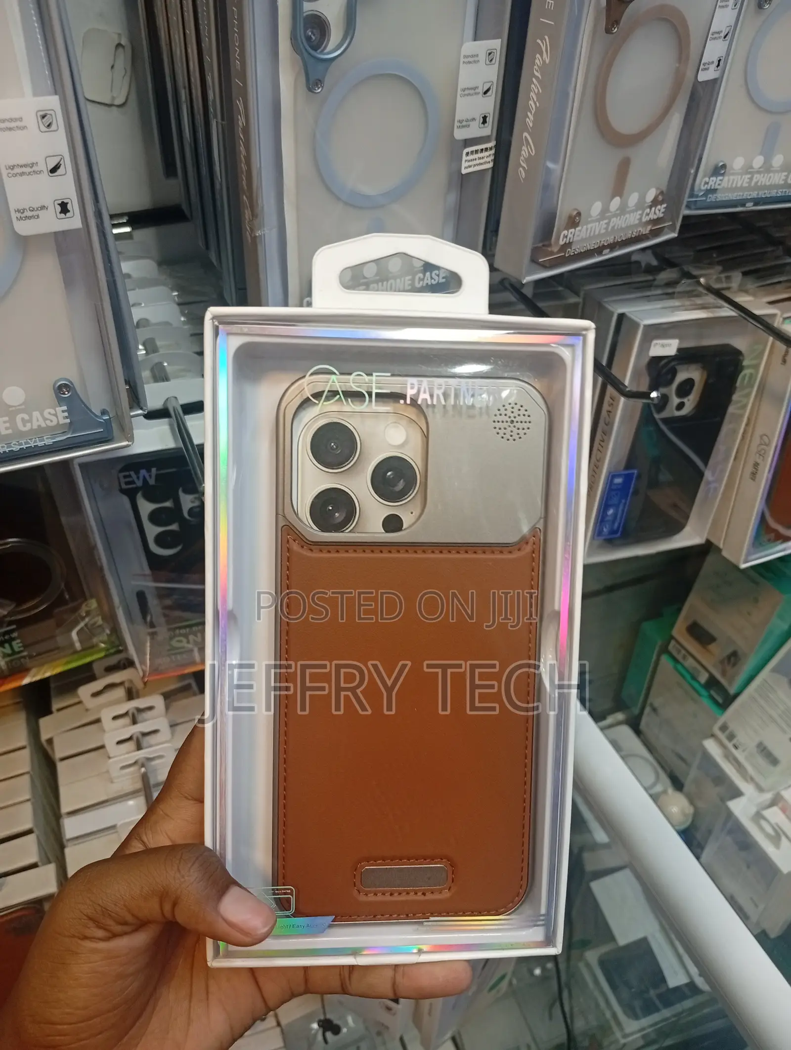 Generic Metal and Brown Leather Phone Case for an iPhone 13 Pro Max.