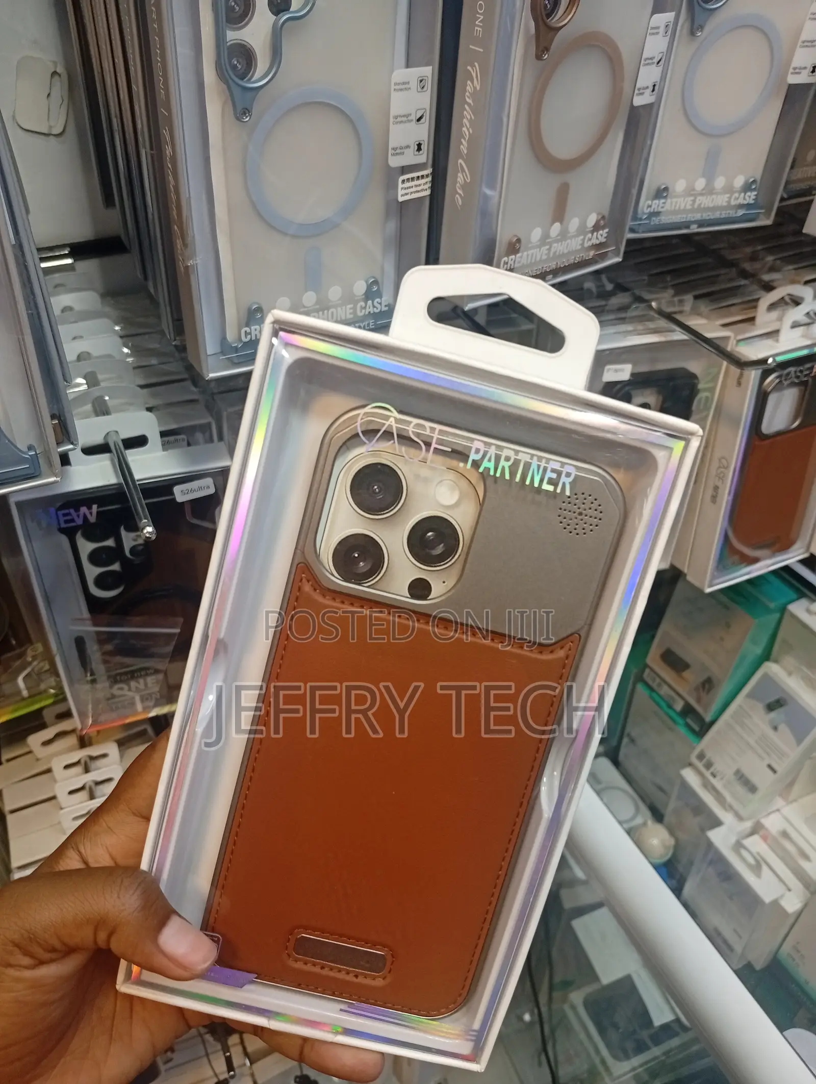 Generic Metal and Brown Leather Phone Case for an iPhone 13 Pro Max.