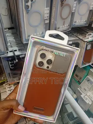 Generic Metal and Brown Leather Phone Case for an iPhone 13 Pro Max.