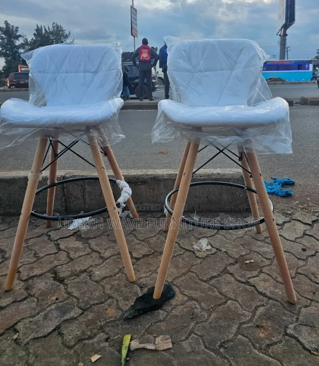 White  Padded Eams Counter Chairs