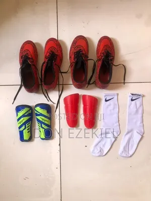 Two Nike Boots, Two Shin Pads and a Pair of Nike Socks