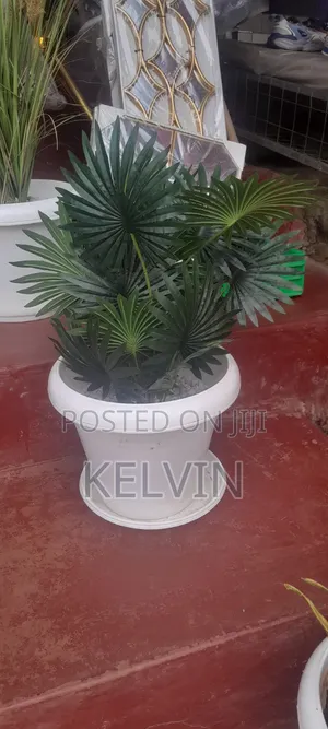 Is a Generic Artificial Flower Arrangement in a White Bucket Vase.
